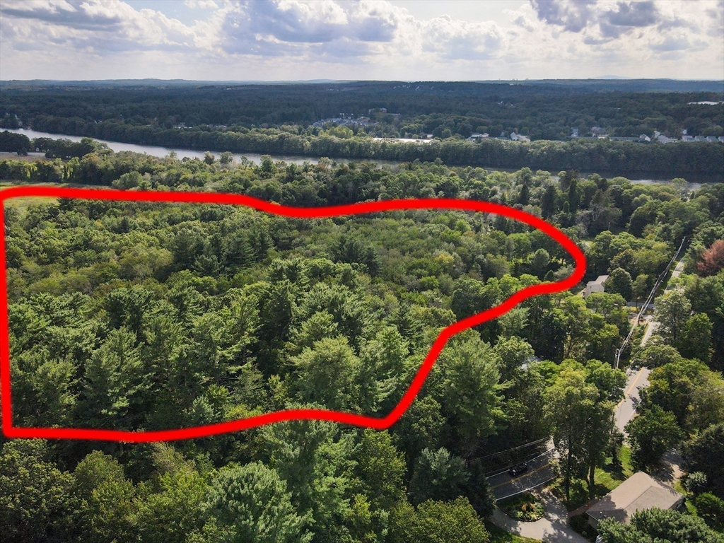 123 Sherburne Avenue Tyngsborough, MA 01879 - Photo 5 of 11 a view of a yard and a houses