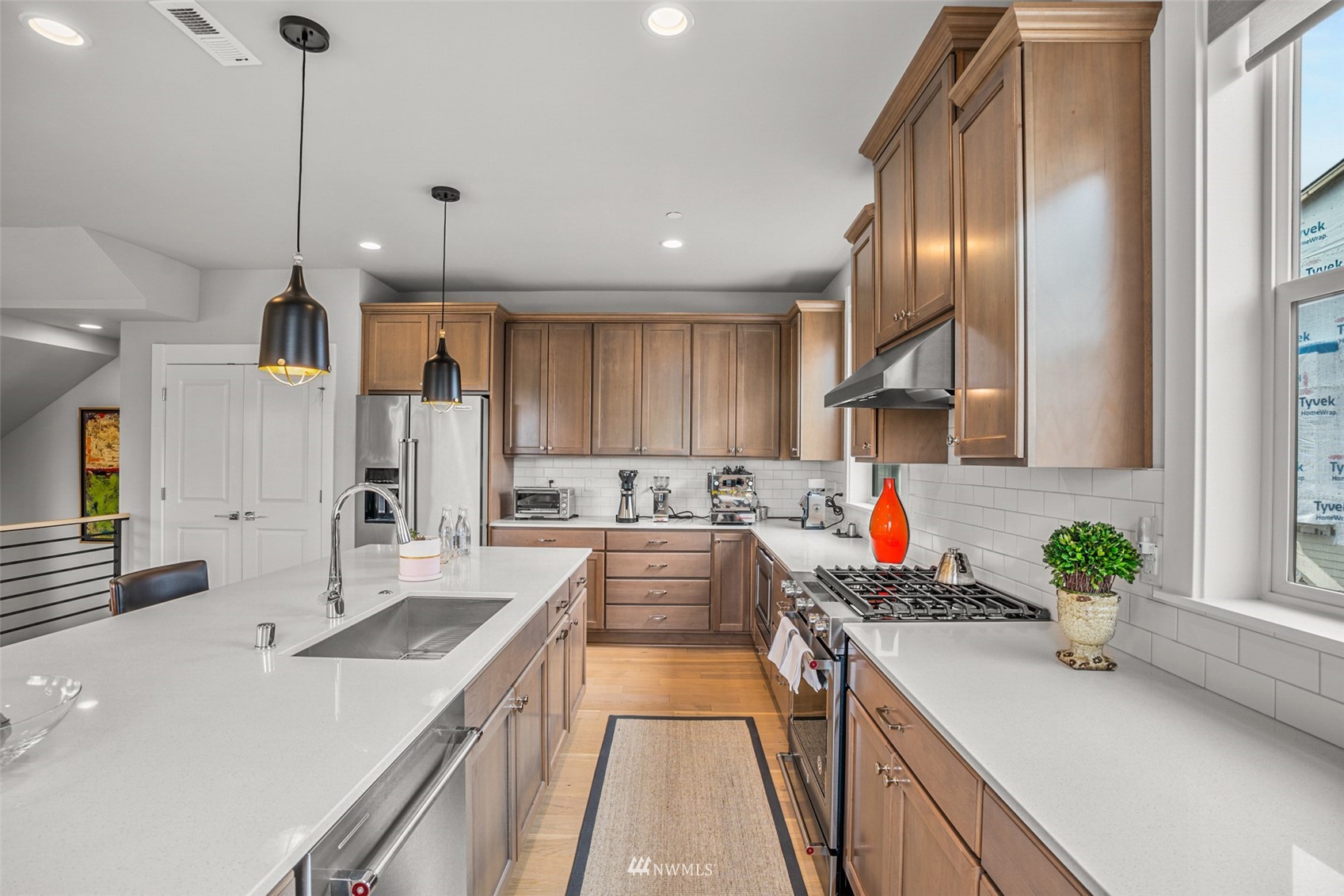 21910 24th Avenue Southeast, Unit A Bothell, WA 98021 - Photo 13 of 40 a kitchen with stainless steel appliances granite countertop sink stove and cabinets