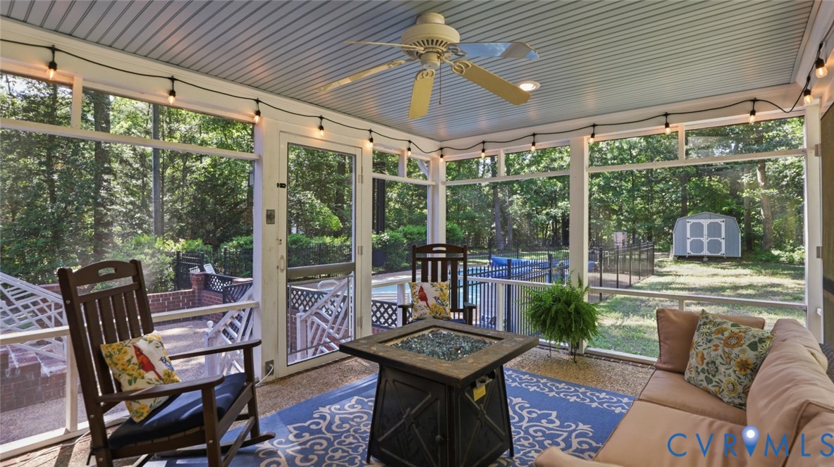 10716 Chalkley Road Richmond, VA 23237 - Photo 5 of 46 a living room with patio furniture and a floor to ceiling window