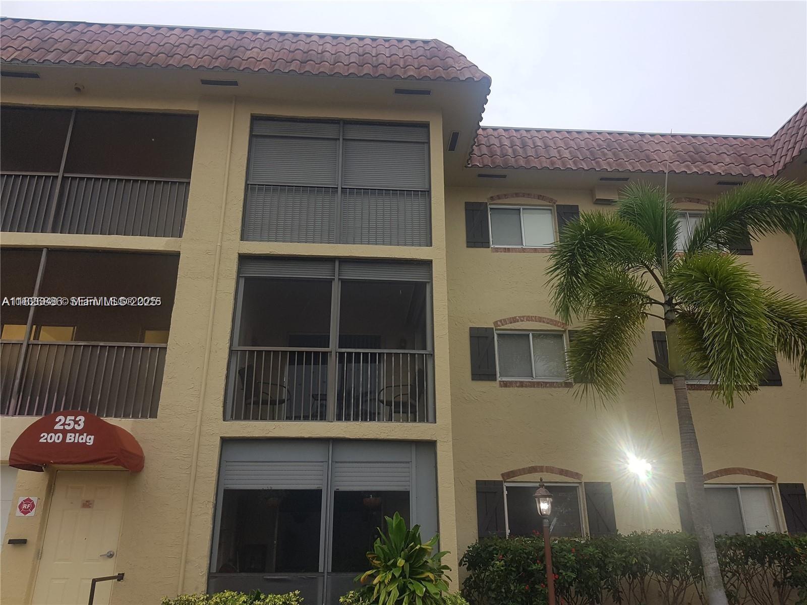 253 South Cypress Road, Unit 237 Pompano Beach, FL 33060 - Photo 21 of 23 a house view with a garden space