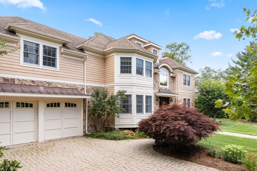 171 Old Farm Road Newton, MA 02459 - Photo 3 of 37 a front view of a house with a garden