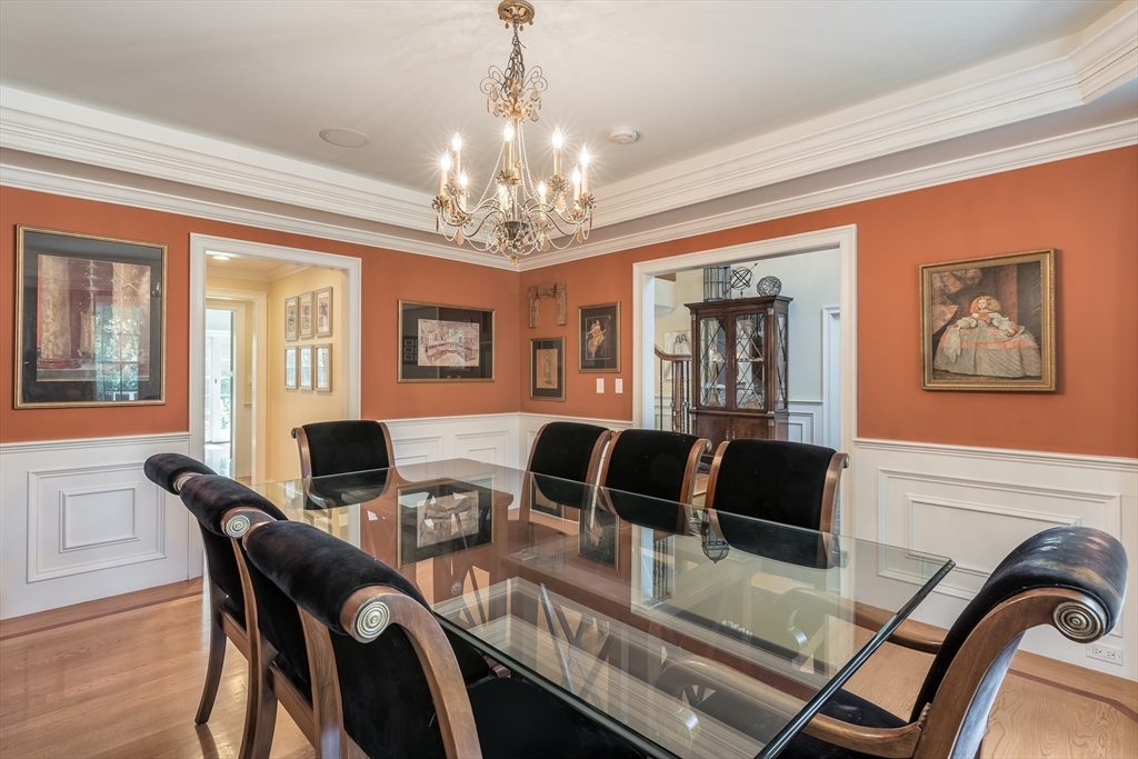 171 Old Farm Road Newton, MA 02459 - Photo 8 of 37 a view of a dining room with furniture a chandelier and wooden floor