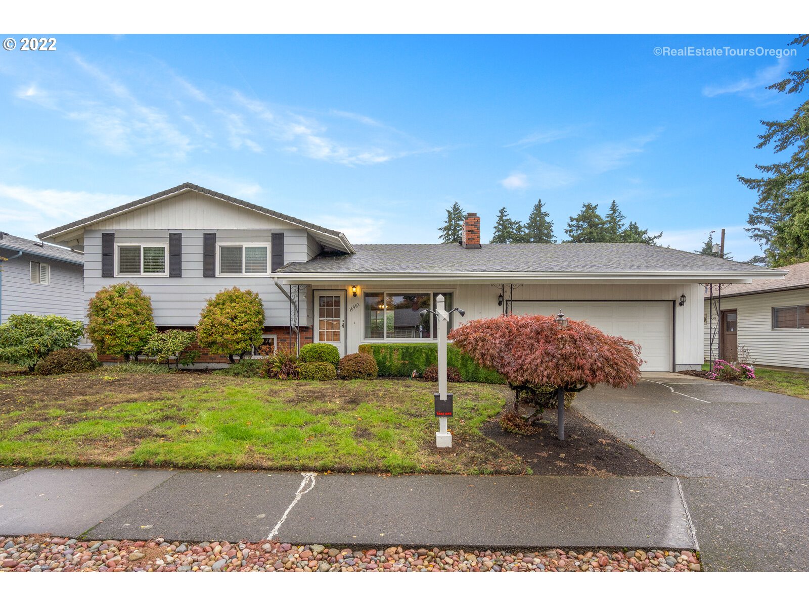 a front view of a house with garden