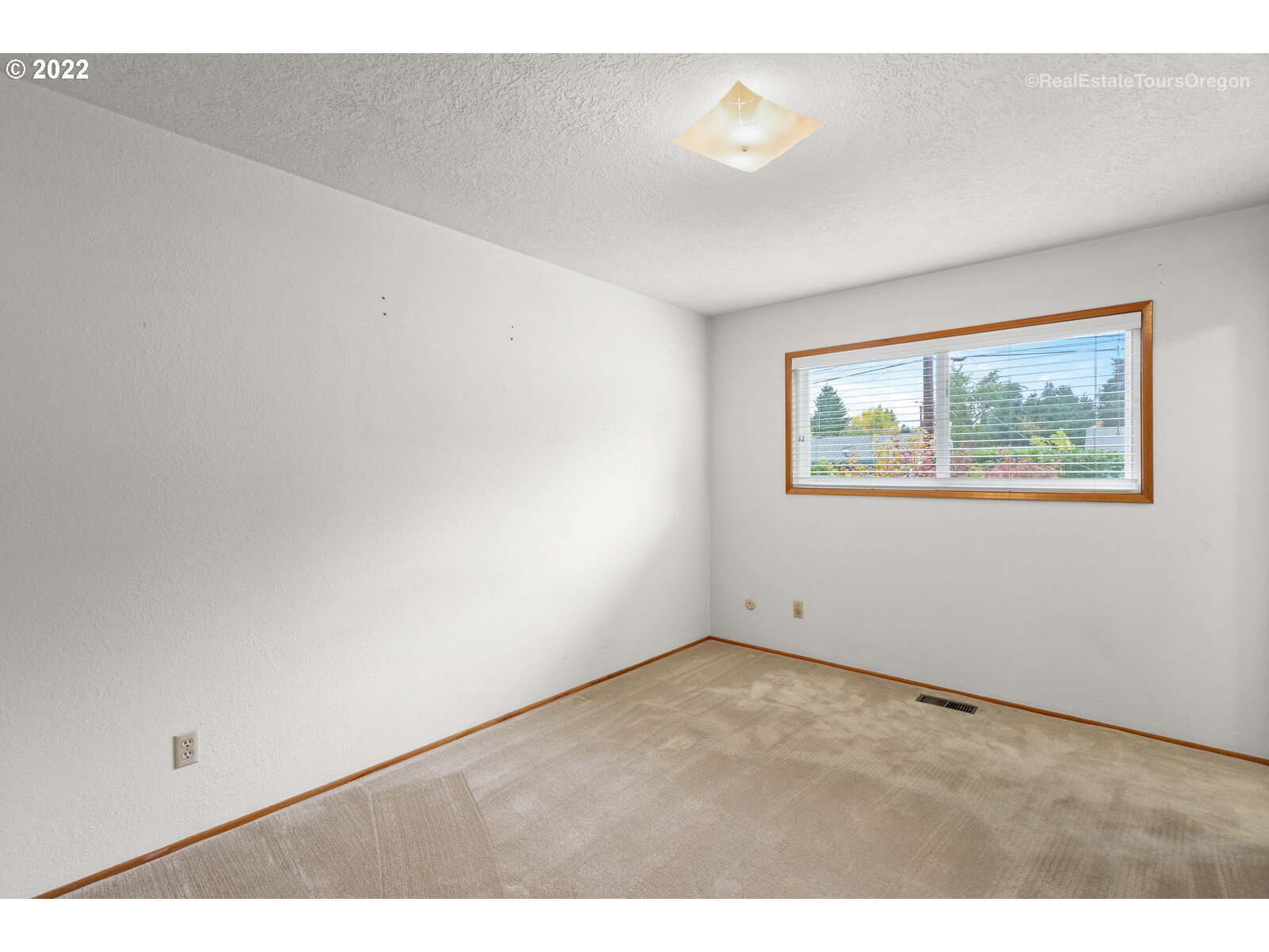 16901 Southeast Haig Street Portland, OR 97236 - Photo 12 of 32 a view of an empty room with a window