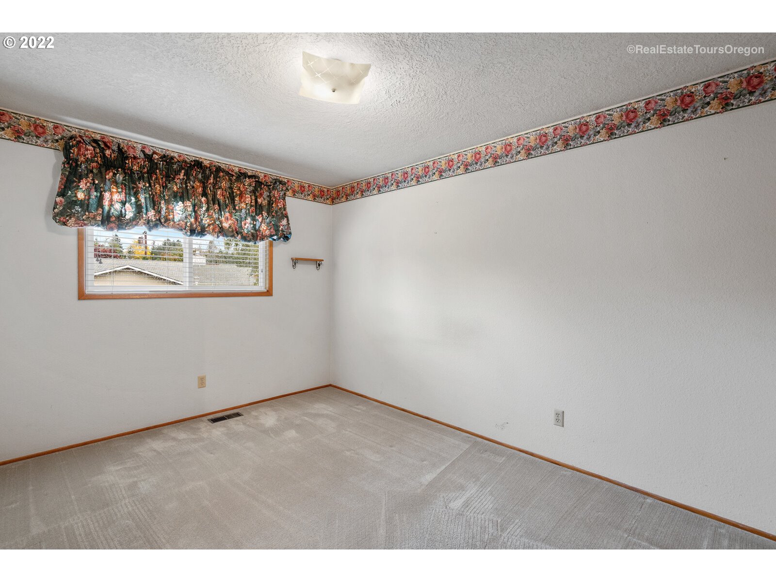 16901 Southeast Haig Street Portland, OR 97236 - Photo 16 of 32 a view of a room with wooden floor and windows