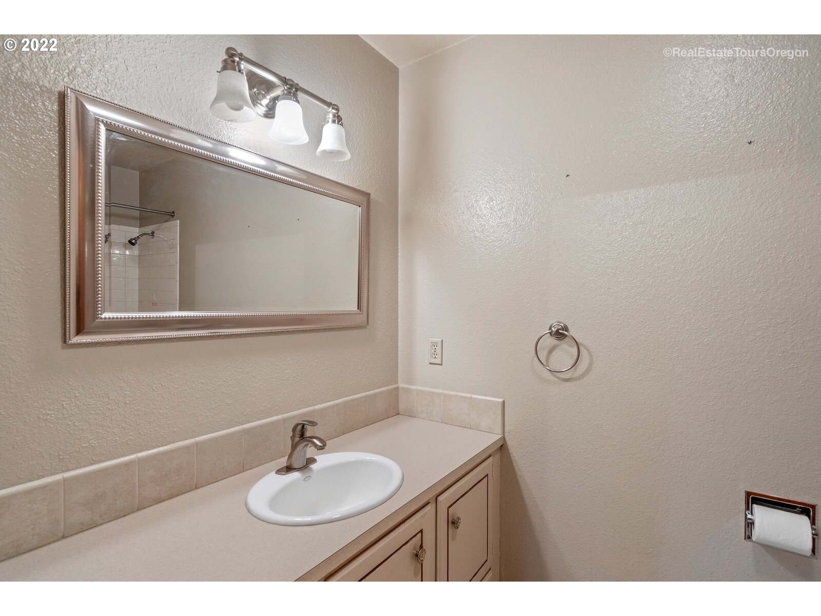 16901 Southeast Haig Street Portland, OR 97236 - Photo 22 of 32 a bathroom with a sink and a mirror