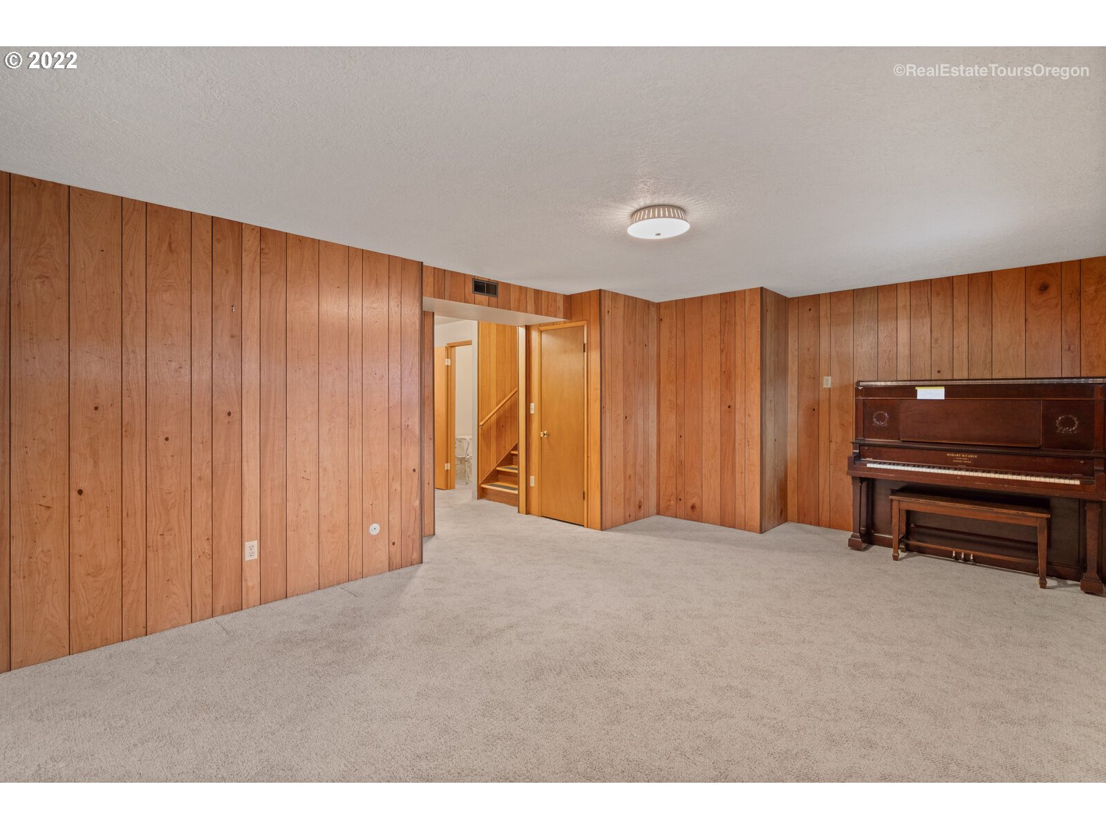 16901 Southeast Haig Street Portland, OR 97236 - Photo 25 of 32 a view of a room with furniture and a piano
