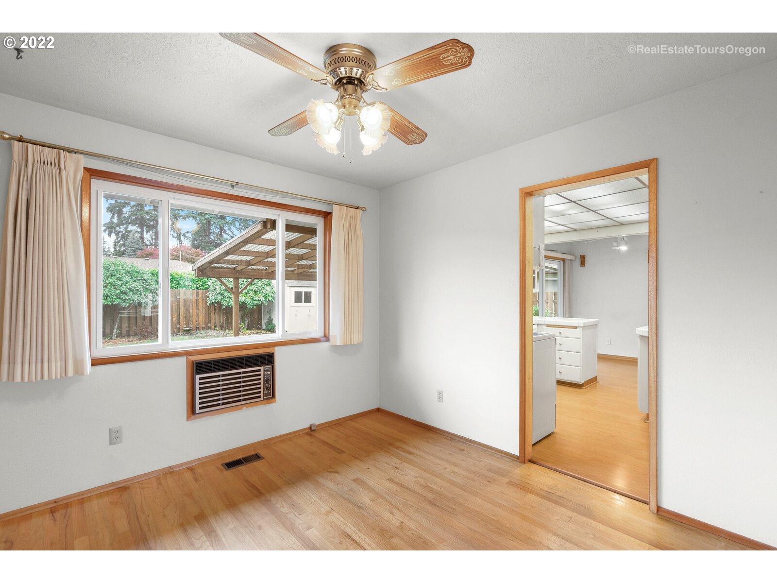 16901 Southeast Haig Street Portland, OR 97236 - Photo 6 of 32 a view of an empty room with a window