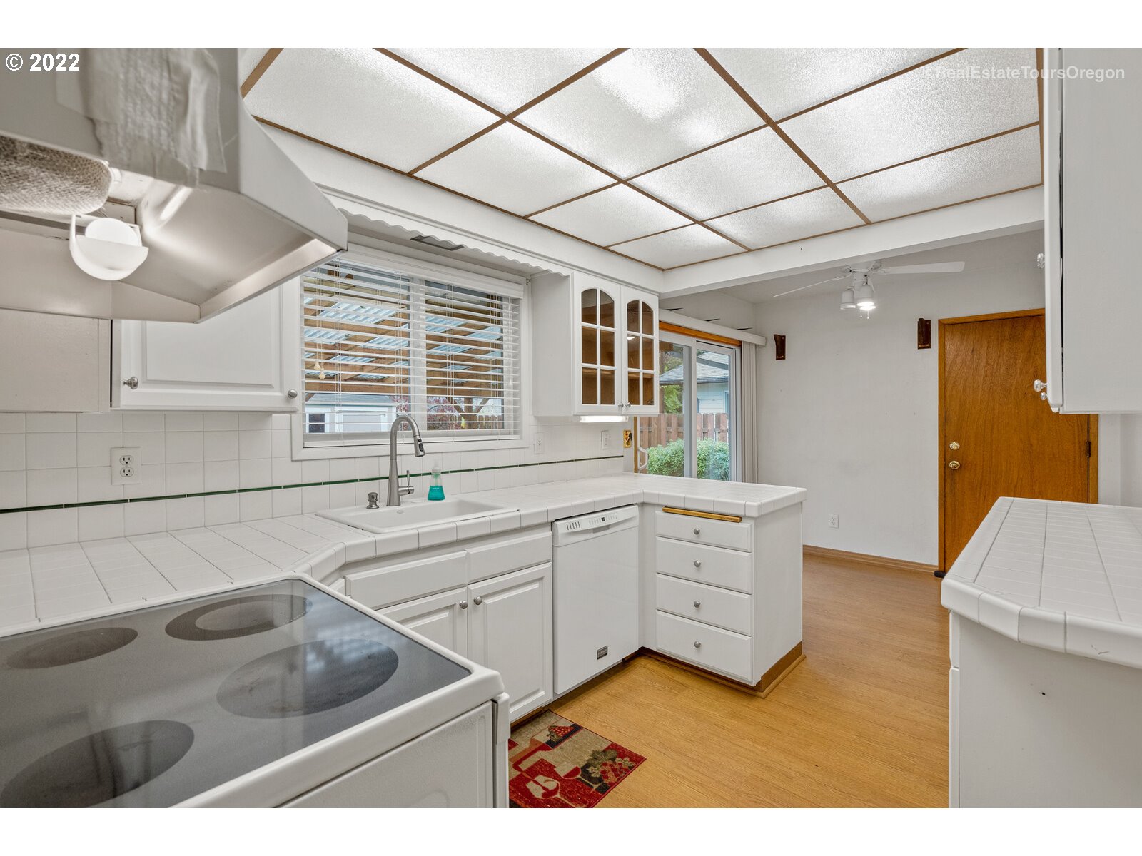 16901 Southeast Haig Street Portland, OR 97236 - Photo 8 of 32 a kitchen with a sink cabinets and window