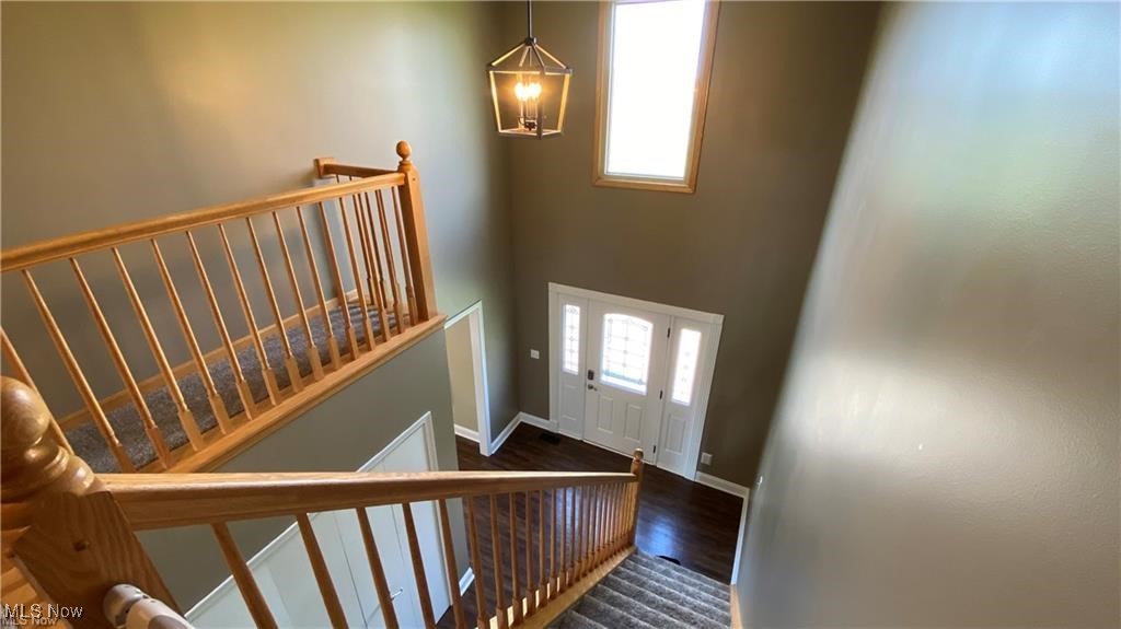 4998 Wayne Road Mantua, OH 44255 - Photo 3 of 43 Staircase with wood-type flooring