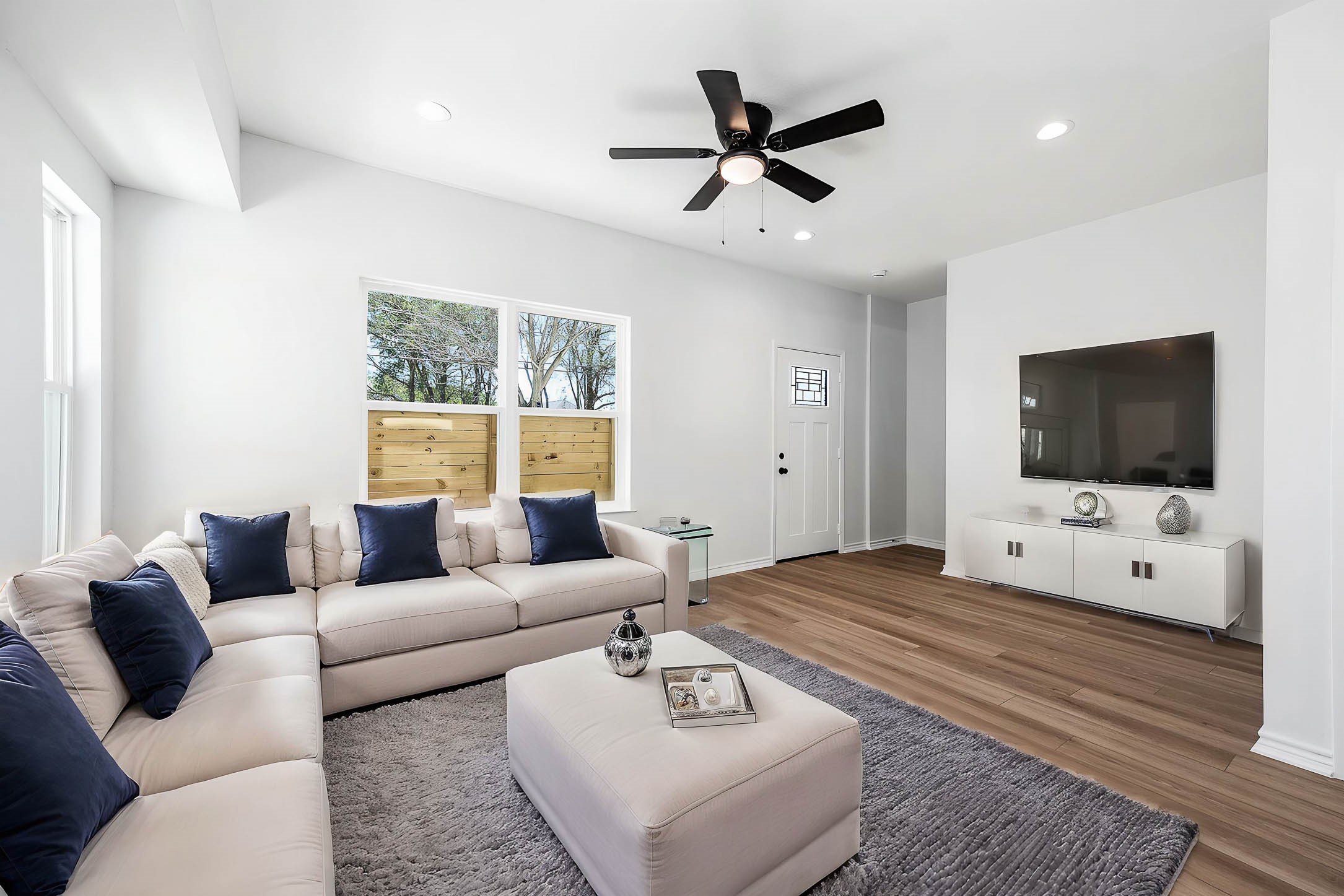 2020 Hampton Street, Unit A B Houston, TX 77088 - Photo 2 of 31 a living room with furniture and a flat screen tv