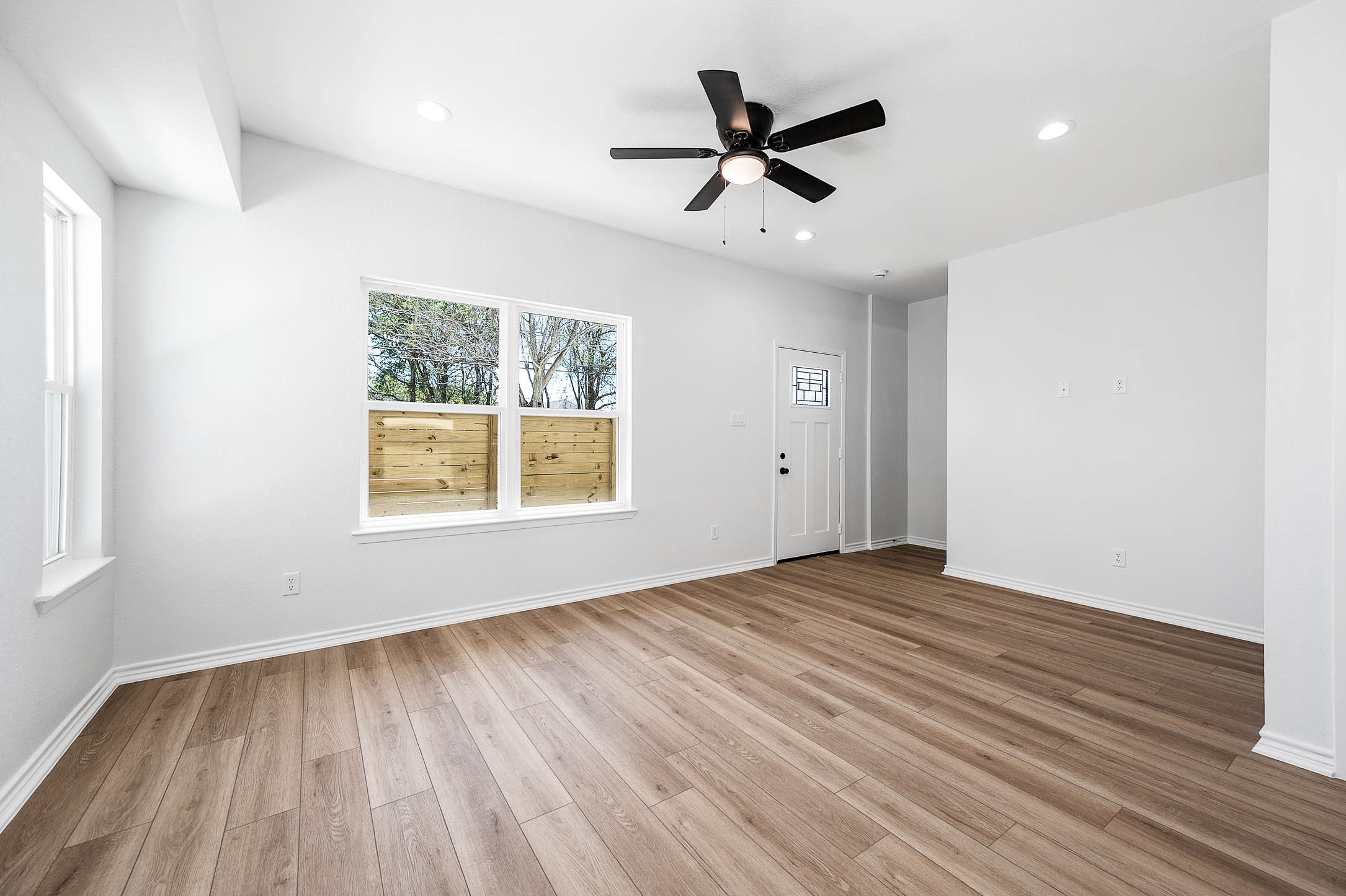 2020 Hampton Street, Unit A B Houston, TX 77088 - Photo 31 of 31 wooden floor in an empty room with a window