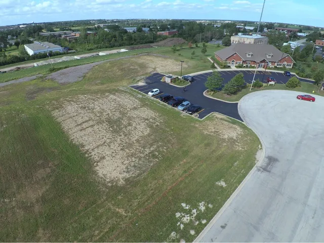 an aerial view of a house with outdoor space