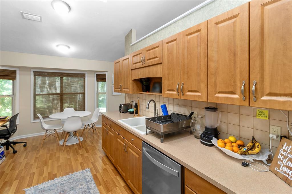 508 Northwest 94th Way Gainesville, FL 32607 - Photo 13 of 30 a kitchen with sink a microwave and cabinets