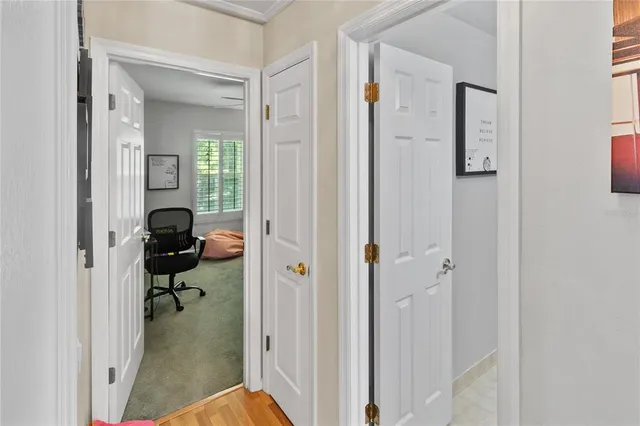 a view of a bathroom from a hallway