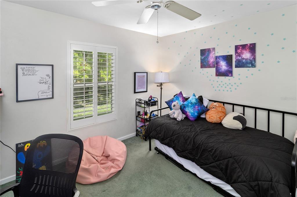 508 Northwest 94th Way Gainesville, FL 32607 - Photo 18 of 30 a bedroom with furniture and a window