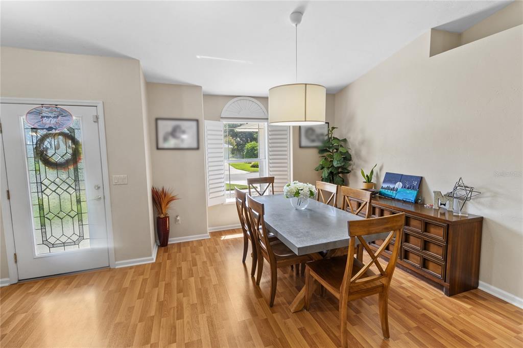 508 Northwest 94th Way Gainesville, FL 32607 - Photo 20 of 30 a view of a dining room with furniture window and wooden floor