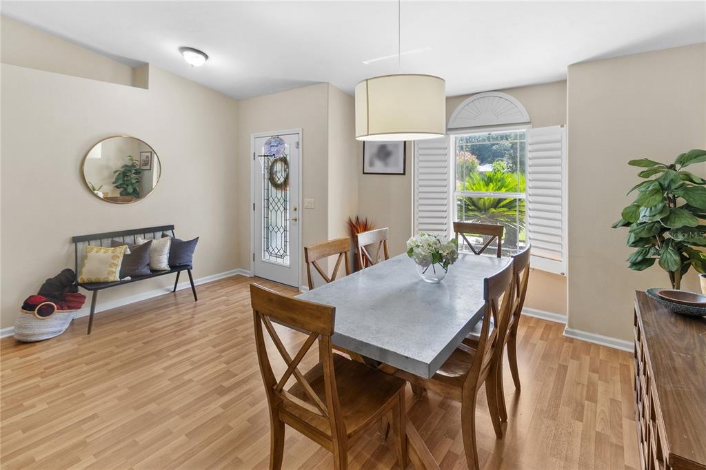 508 Northwest 94th Way Gainesville, FL 32607 - Photo 21 of 30 a view of a dining room with furniture and a potted plant