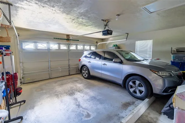 a view of parking garage with cars parked