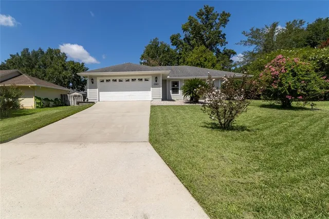 a view of house with outdoor space porch and garden
