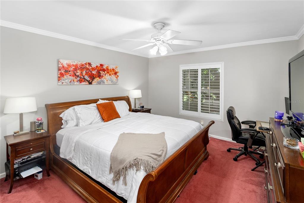 508 Northwest 94th Way Gainesville, FL 32607 - Photo 8 of 30 a bed sitting in a bedroom next to a window