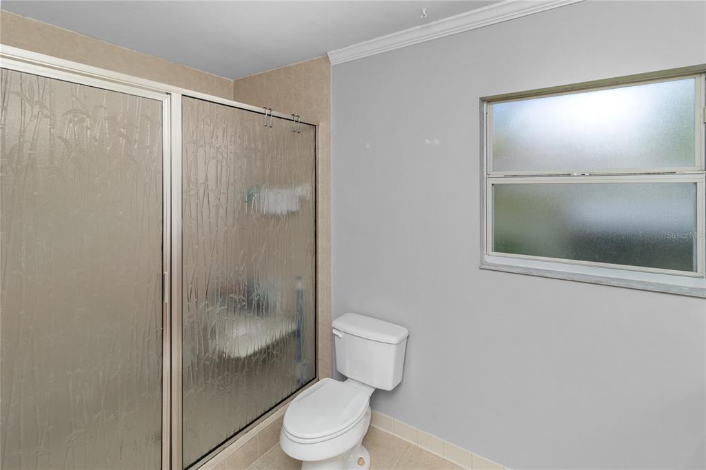 508 Northwest 94th Way Gainesville, FL 32607 - Photo 9 of 30 a bathroom with a shower a toilet and a sink