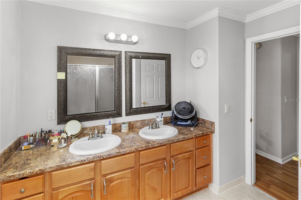 508 Northwest 94th Way Gainesville, FL 32607 - Photo 10 of 30 a bathroom with double sink and a mirror