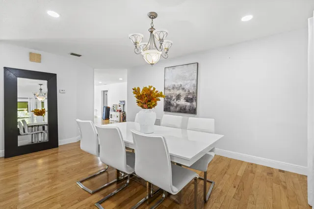 a bathroom with a double vanity sink a mirror and a shower
