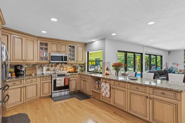 a lobby with furniture and a potted plant