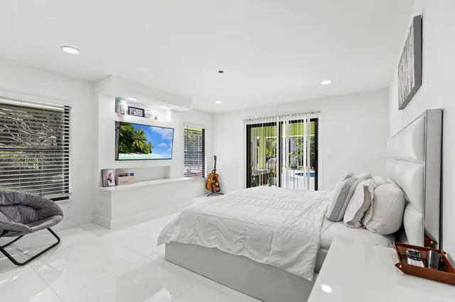 a view of a patio with a table and chairs