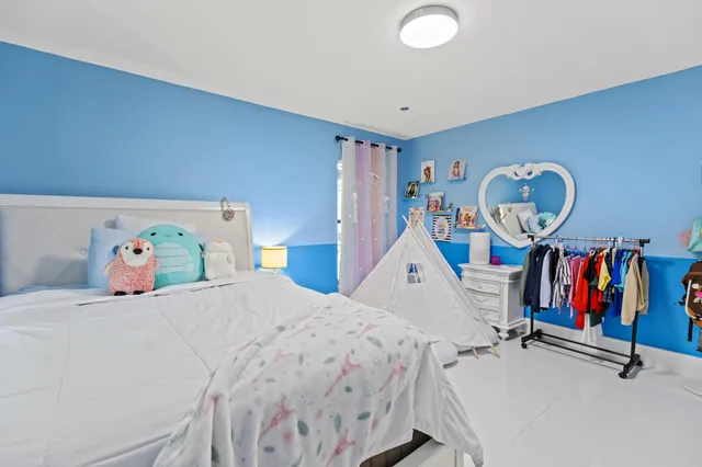 a kitchen with a sink a cabinets and appliances