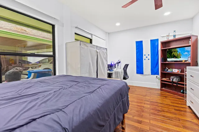 a kitchen with a sink refrigerator and cabinets