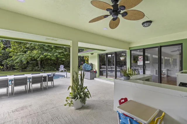 a view of a city with lush green forest