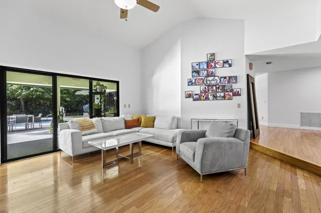 a bedroom with furniture and a flat screen tv