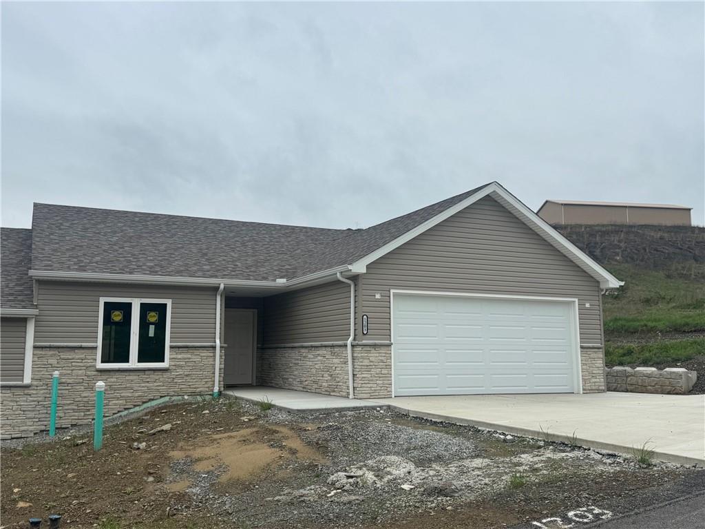 a front view of a house with a garage