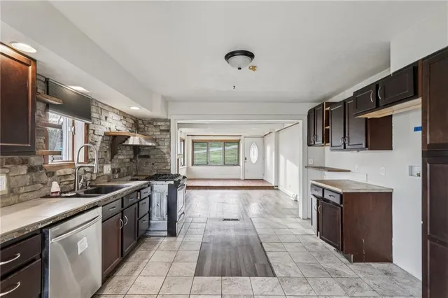 a large kitchen with a stove top oven