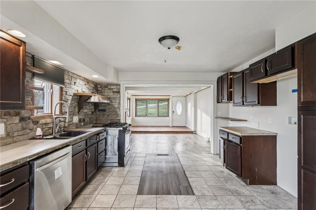 32 Stadium Road Millsboro, PA 15348 - Photo 17 of 47 a large kitchen with a stove top oven