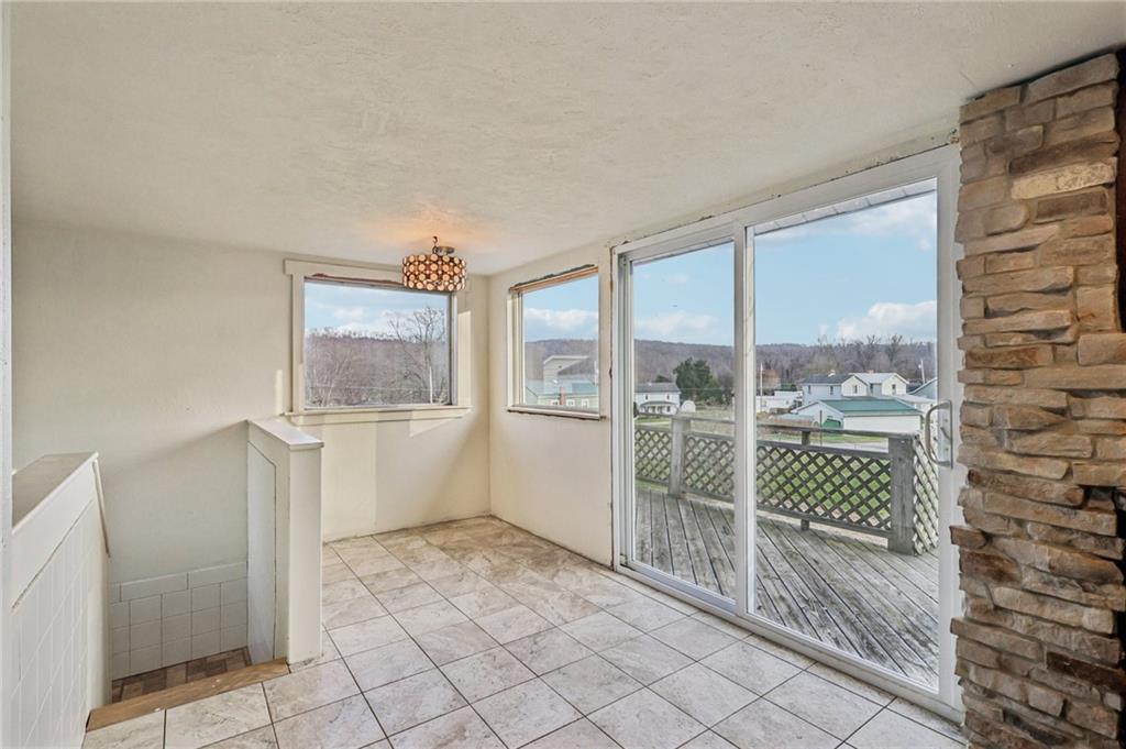 32 Stadium Road Millsboro, PA 15348 - Photo 20 of 47 a bathroom with a bathtub and next to a window