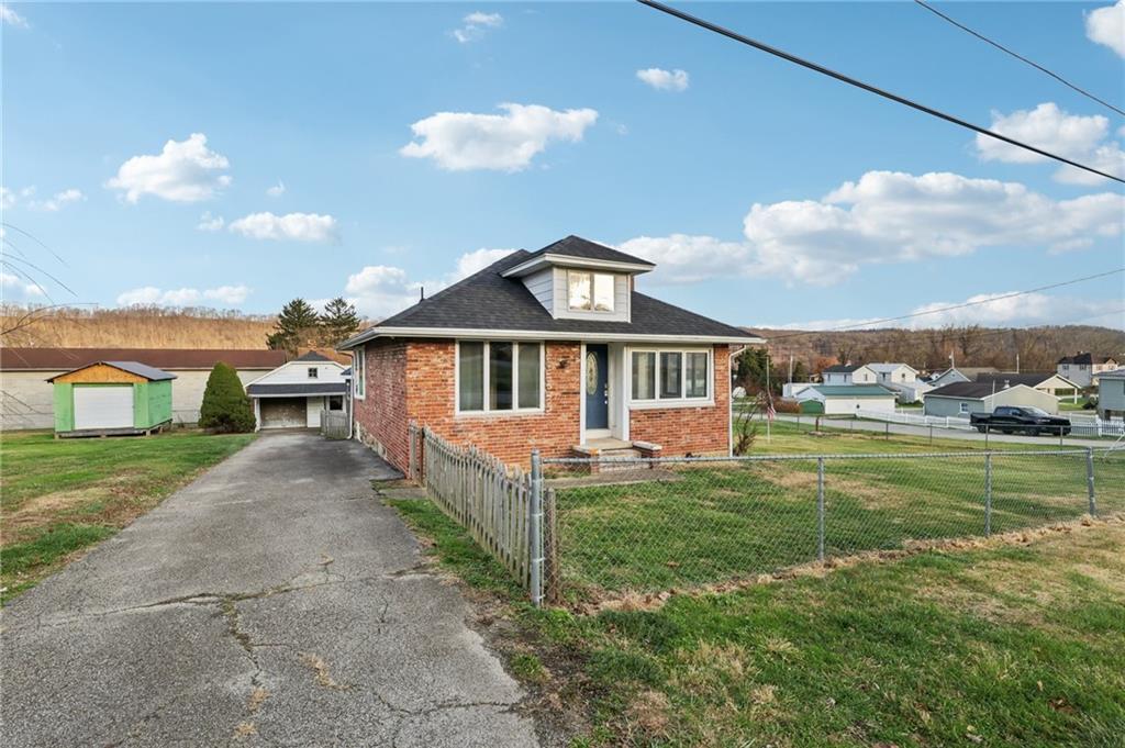 32 Stadium Road Millsboro, PA 15348 - Photo 2 of 47 a front view of a house with a yard