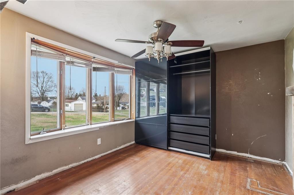 32 Stadium Road Millsboro, PA 15348 - Photo 24 of 47 a view of empty room with wooden floor and fan