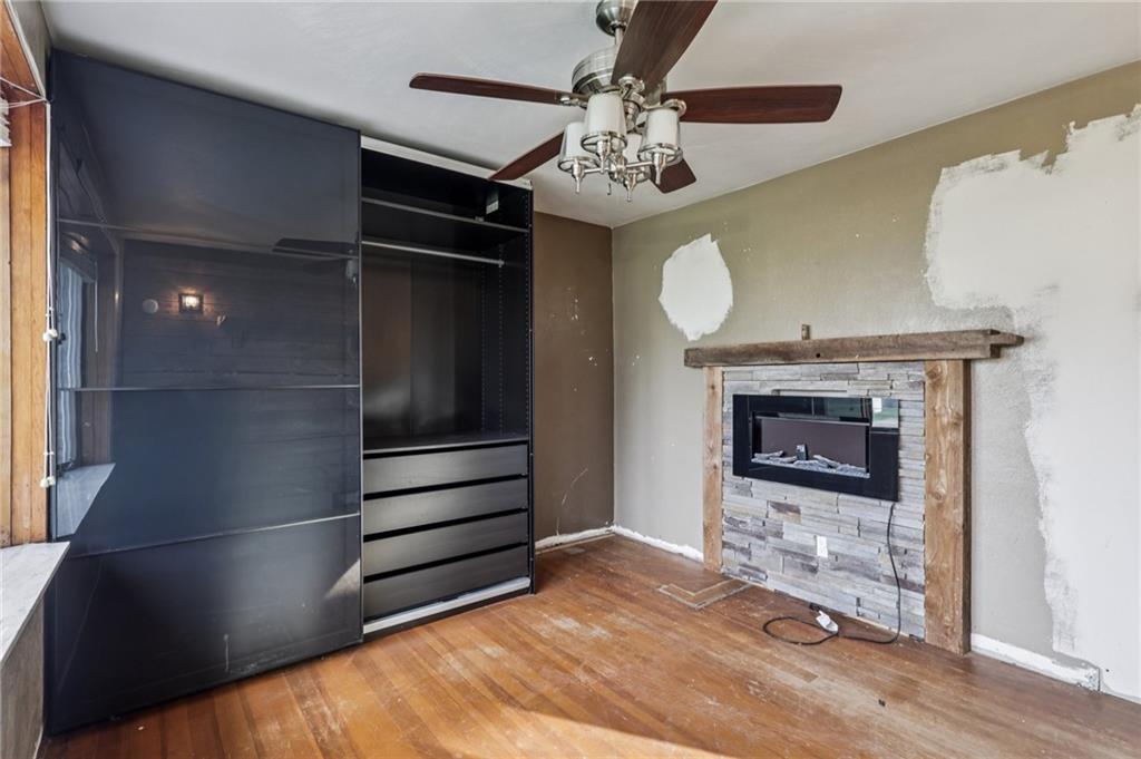 32 Stadium Road Millsboro, PA 15348 - Photo 27 of 47 a view of an empty room with a fireplace and a window