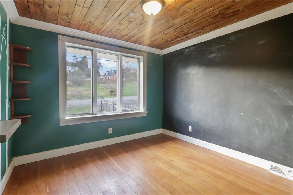 32 Stadium Road Millsboro, PA 15348 - Photo 28 of 47 a view of empty room with wooden floor and fan