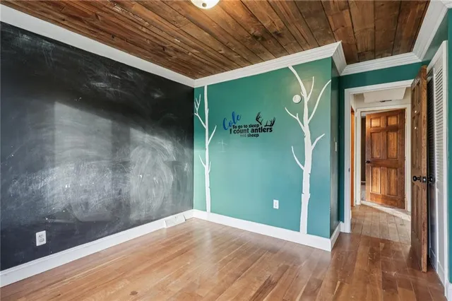 a view of a door and wooden floor