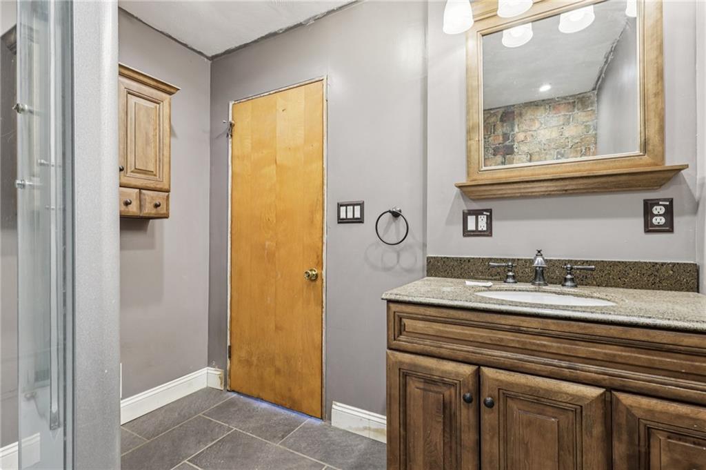 32 Stadium Road Millsboro, PA 15348 - Photo 33 of 47 a bathroom with a sink and a mirror