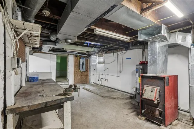 a view of empty room with wooden ceiling
