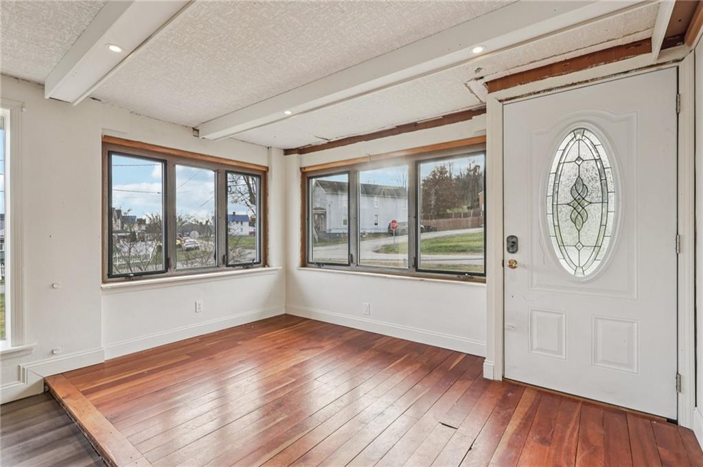 32 Stadium Road Millsboro, PA 15348 - Photo 5 of 47 a view of empty room with wooden floor and fan