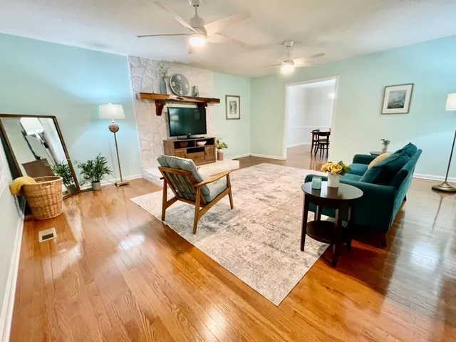 a living room with furniture and a flat screen tv