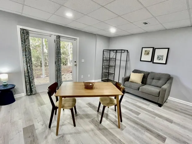 a view of a room with a white bed