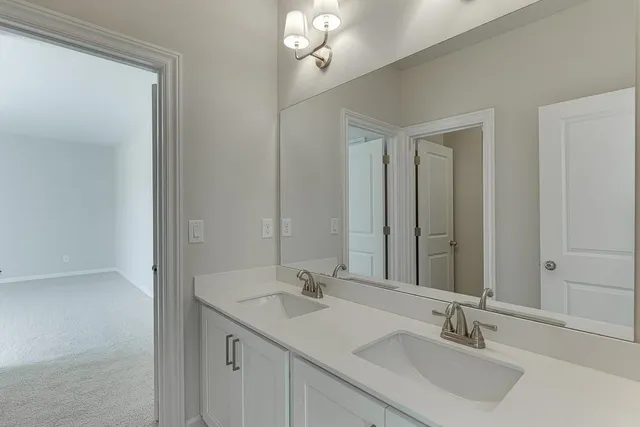 an empty room with a ceiling fan and window
