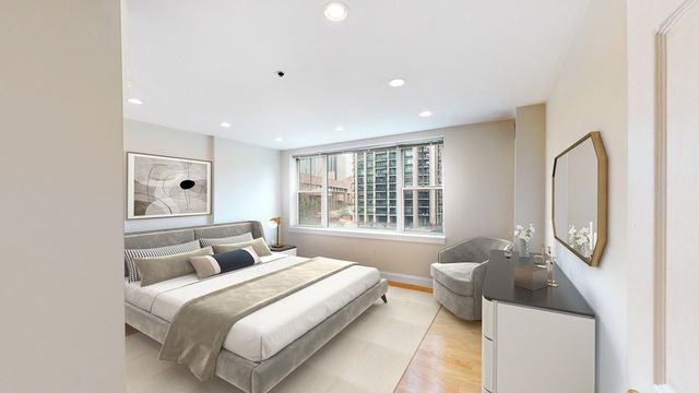 a bed room with a bed and a mirror